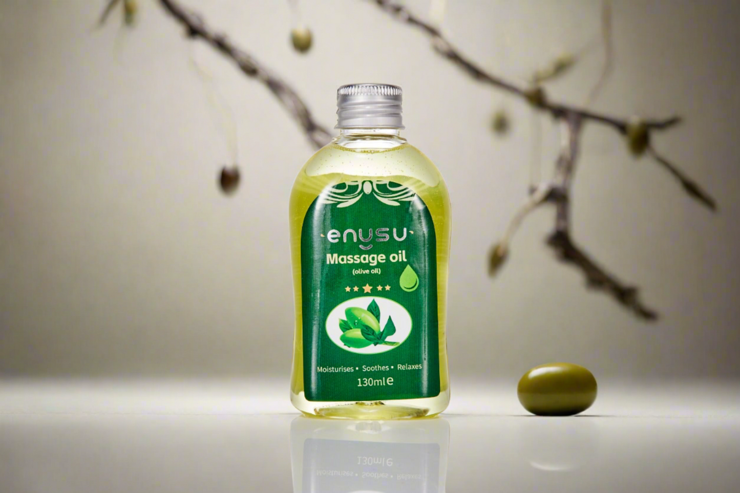 Enusu LADYBLOOM massage oil bottle with a green label on a neutral background