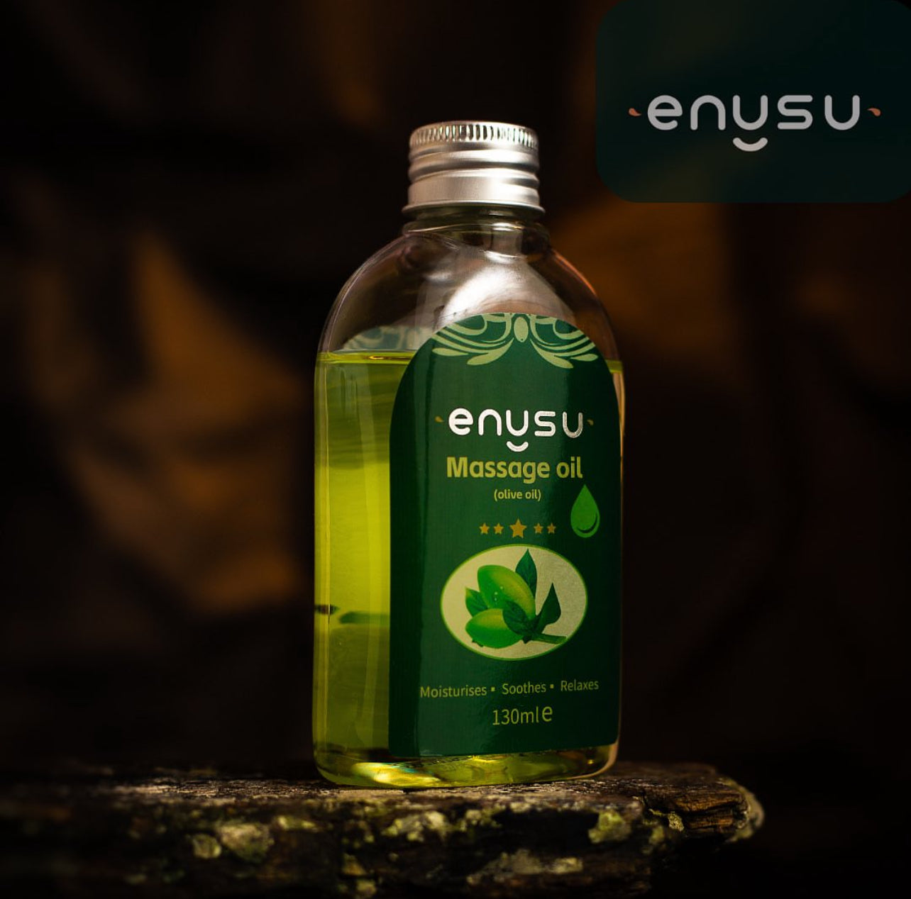 Bottle of enysu LADYBLOOM massage oil on a dark background